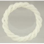 A CHINESE WHITE JADE DOUBLE TWIST BANGLE. 3.25ins diameter.