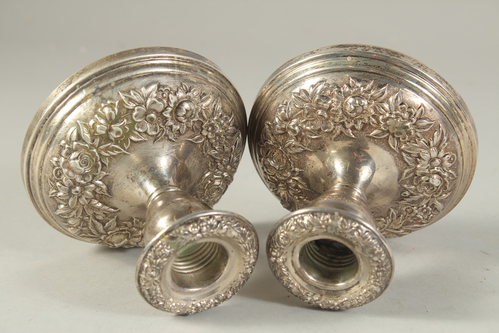 A PAIR OF SILVER EMBOSSED SQUARE CANDLESTICKS. 3.5ins high. - Image 2 of 4