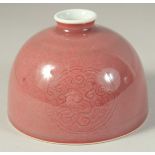 A CHINESE COPPER RED GLAZE WATERPOT. 12.5cm high.