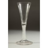 A GOOD 18TH CENTURY ENGLISH WINE GLASS with tapering bowl and white twist stem. 7.5ins