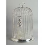 A GOOD SILVER PLATED BIRD CAGE with bird decanter and eight glasses. 18ins high.