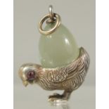 A SILVER AND JADE CHICK PENDANT.