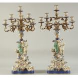 A GOOD PAIR OF SEVRES DESIGN PORCELAIN TEN LIGHT CANDELABRA with gilt metal branches, the base