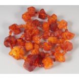 A GOOD FACETED AMBER GRADUATED NECKLACE, 32 beads, 25ins long, 100gms.