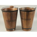 A PAIR OF BOLLINGER WOODEN ICE BUCKETS with metal handles. 16ins high.