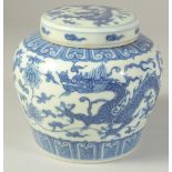 A CHINESE BLUE AND WHITE PORCELAIN GINGER JAR decorated with dragons. 12cm high.