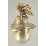 A SMALL RUSSIAN SILVER GILT EAGLE AND HELMET EGG PENDANT.