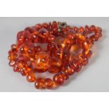 A GOOD SMALL AMBER GRADUATED BEAD NECKLACE. 80 beads, 22ins long. 36gms.