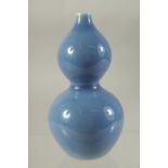 A SMALL CHINESE BLUE GOURD VASE. 4.5ins high.