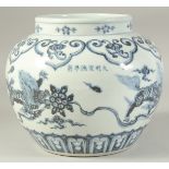 A CHINESE BLUE AND WHITE PORCELAIN JAR decorated with beasts. 19.5cm high.