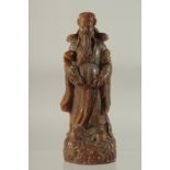 A CARVED HORN CHINESE DEITY. 8ins high.