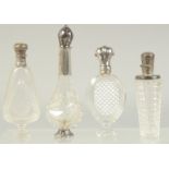 FOUR GOOD 19TH CENTURY FRENCH SILVER MOUNTED GLASS SCENT BOTTLES.