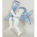 A DELFT POTTERY BLUE AND WHITE ANGEL WALL POCKET. 9.5ins.