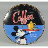 AN ENAMEL CIRCULAR MICKEY MOUSE COFFEE SIGN. 11ins diameter/.