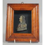 A FRAMED CARVED WOOD PAINTED AND GLAZED RELIEF OF CHARLES 1ST.