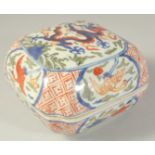 A CHINESE WUCAI PORCELAIN DRAGON BOX. 16.5ins wide.