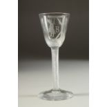 A RARE 18TH CENTURY ENGLISH JUSTICE ADMIRAL BYNG WINE GLASS engraved with a hanged man and