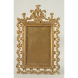 A GOOD GILDED BRONZE EASEL PHOTOGRAPH FRAME with classical bust, scrolls and foliage. 1ft 3ins