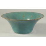A CHINESE TURQUOISE GLAZE BOWL with incised characters. 22 cm diameter.