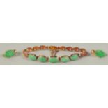 A 9CT GOLD AND CABOCHON JADE BRACELET 5 STONES and a pair of ear studs.