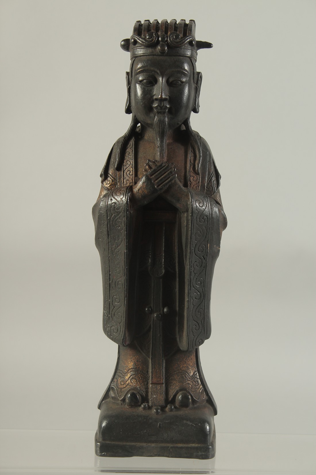 A CHINESE BRONZE FIGURE OF A DEITY. 12ins high.