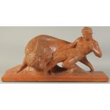 PIERRE POLBERT. CIRCA. 1930. A GOOD LARGE ART DECO TERRA COTTA GROUP OF A CLASSICAL YOUNG MAN