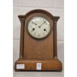 An oak cased mantle clock.