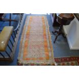 A small worn Persian rug, 193cm x 83cm.