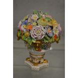 A Stevens and Hancock Derby flower encrusted urn.