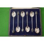 A cased set of six silver coffee bean spoons.