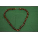 An amber graduated bead necklace.