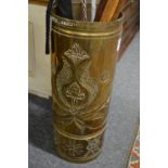 A heavy brass stick stand with incised decoration.