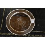 A silver circular equestrian presentation plate.