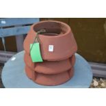 A small terracotta chimney pot.