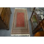 A small modern Persian design rug, 144cm x 66cm.