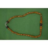 An amber style necklace.