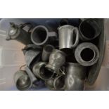 A quantity of pewter tankards etc.