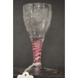 A good small Jacobean wine glass, the bowl engraved with a rose and butterfly with pink and white