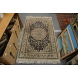 A Persian part silk rug, cream ground with stylised decoration 155cm x 93cm.