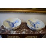 A pair of blue and white decorated bowls.