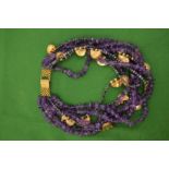 A large decorative amethyst and gilt metal necklace.