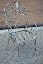 A good naturalistic style wrought metal garden armchair.