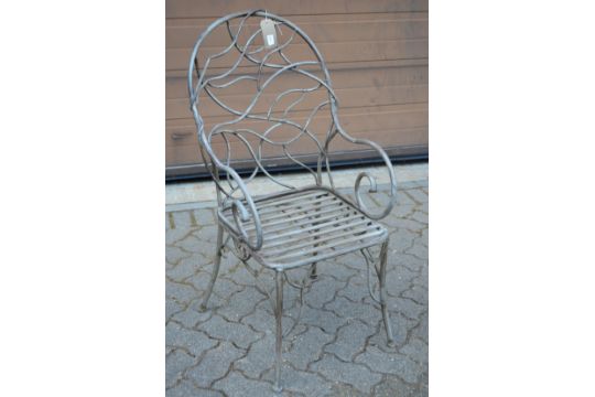 A good naturalistic style wrought metal garden armchair.