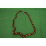 A good small amber and bead necklace of graduated beads.