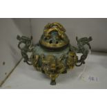 An ornate Chinese bronze censer and cover.