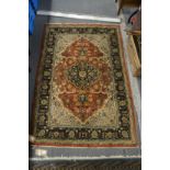 A Persian design rug with floral decoration, 138cm x 90cm.