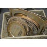 A large silver plated twin handled tray and various other trays and dishes.