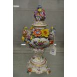 A Dresden floral encrusted twin handled pedestal urn and cover.