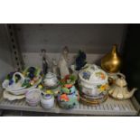 A shelf of decorative china to include a pair of Herend basket weave dishes.