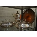 A pair of plated entree dishes, an ice bucket and tray.